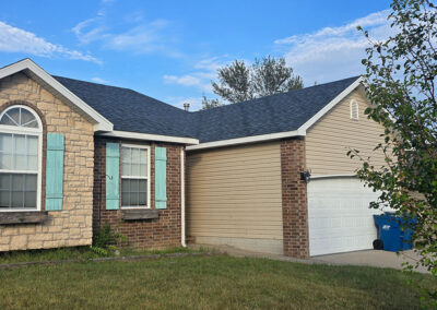 Front view of a home with a new roof installed by Roof For Less in Springfield, MO.